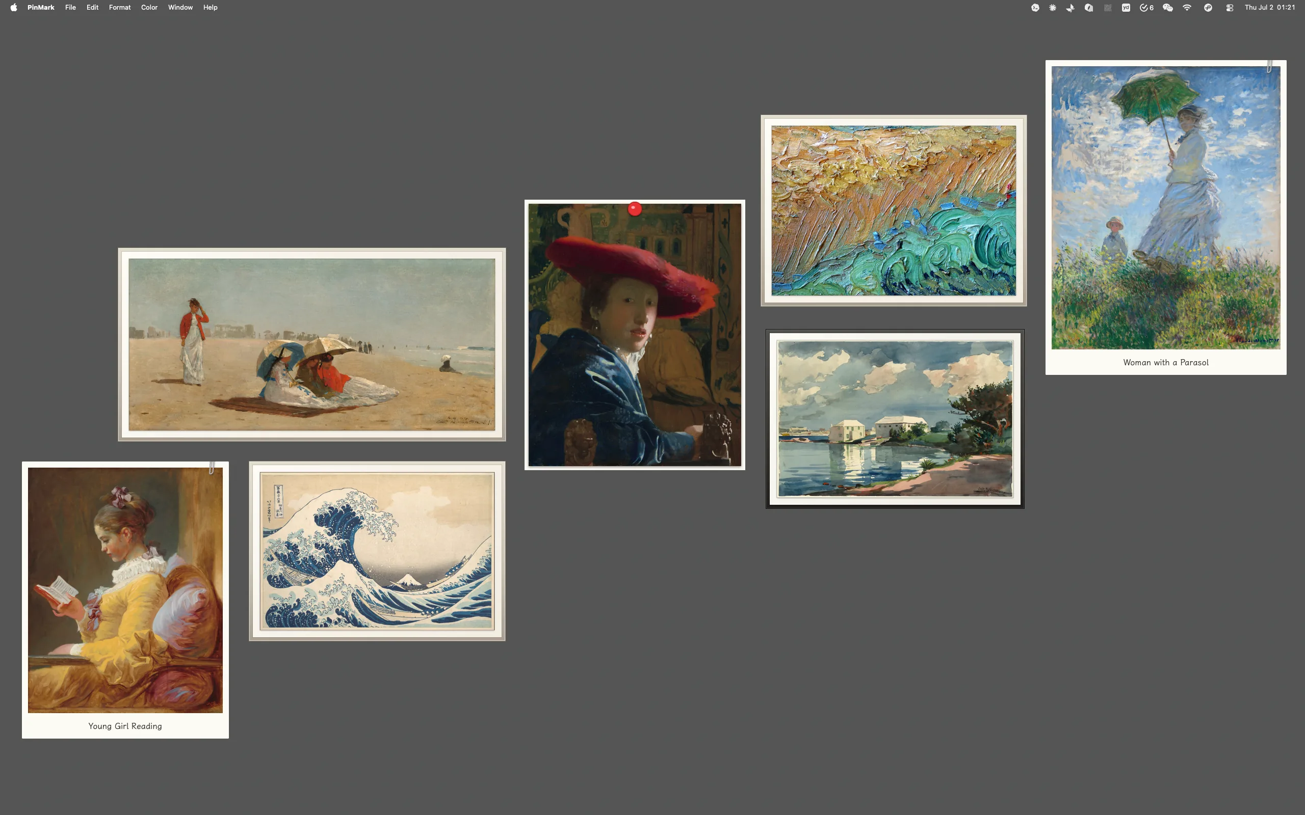 A macOS desktop arranged as a photo wall with framed, pinned, and Polaroid-style photos